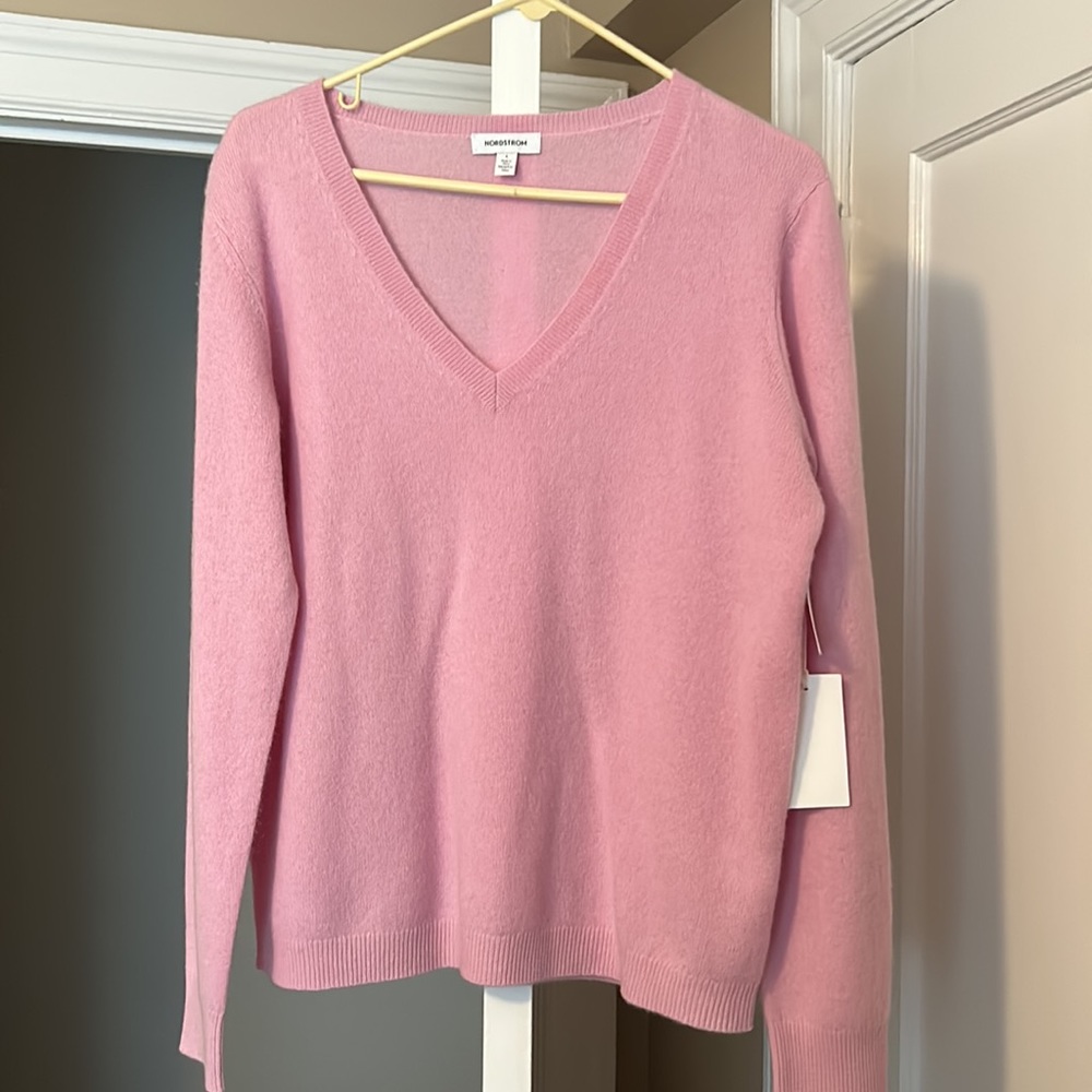 Brand new never worn Nordstrom cashmere sweater, pink size large with tags.